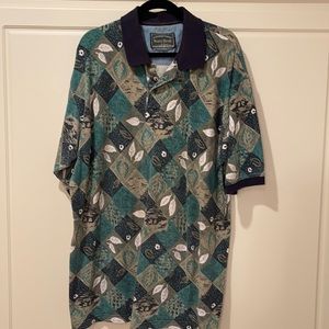 Men short sleeve polo style shirt by North River. Multi color. Size 1XLT $25.00.